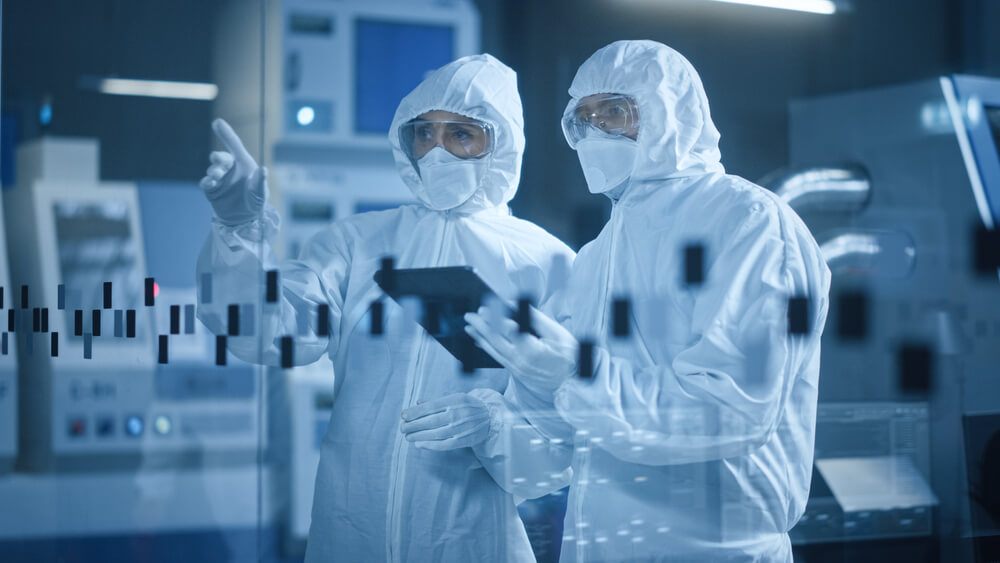 Engineer and Scientist Wearing Coveralls, Standing in Factory Cleanroom